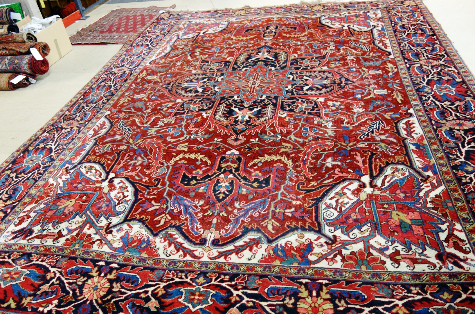 Appraisal: An Heriz carpet Persian the madder field with a bold