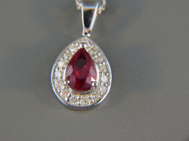 Appraisal: Ruby and Diamond Pendantpear shape rich gem weighing carat surrounded