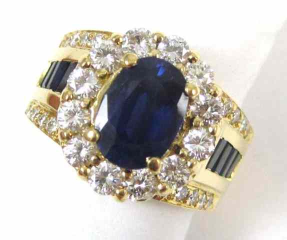 Appraisal: SAPPHIRE DIAMOND AND FOURTEEN KARAT GOLD RING eight baguette-cut blue