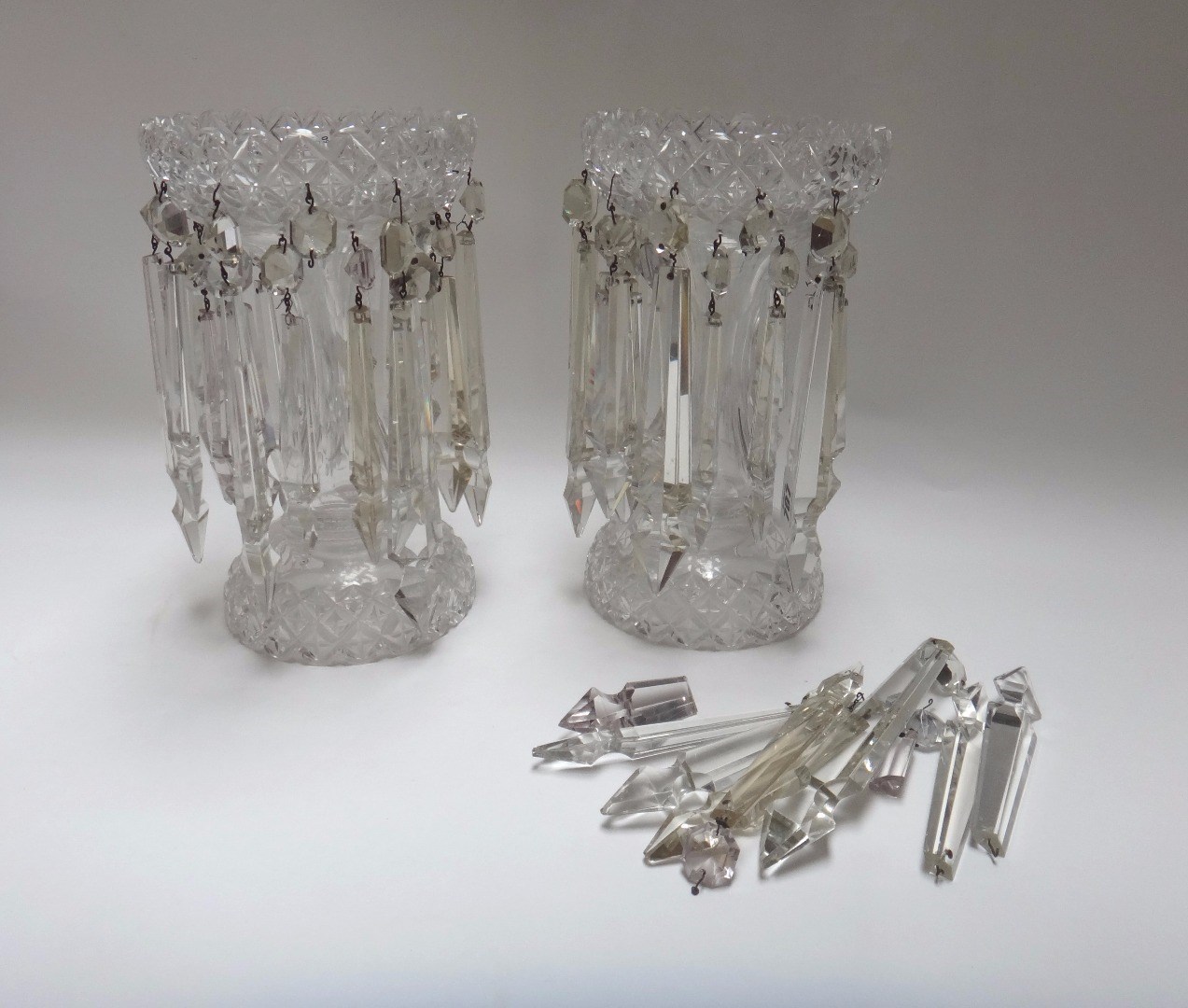 Appraisal: A pair of moulded glass lustres th century each hung