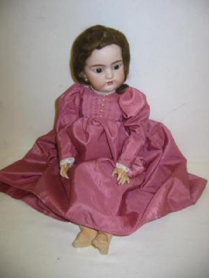 Appraisal: A Simon Halbig head girl doll with fixed brown eyes