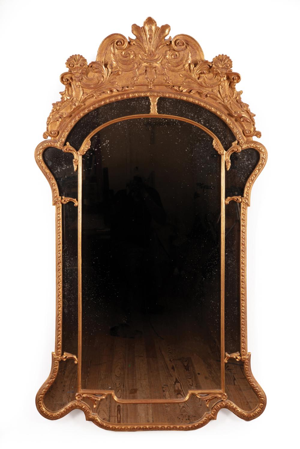 Appraisal: Regence-Style Giltwood Mirror foliate and scroll crest gadrooned border h