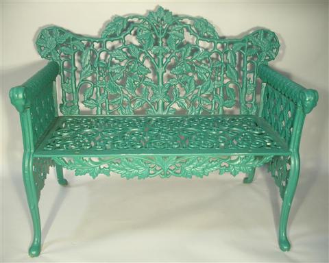 Appraisal: GREEN PAINTED CAST IRON GARDEN BENCH th century the shaped