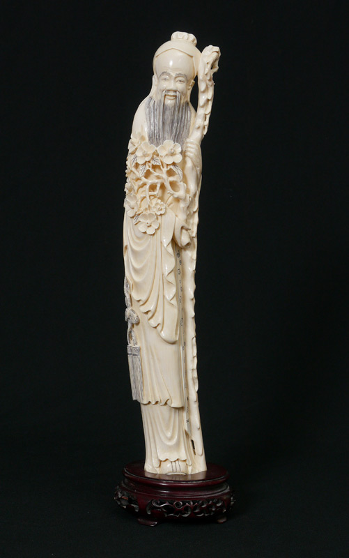 Appraisal: LARGE CARVED IVORY ELDER FIGURE Figure of a wise man