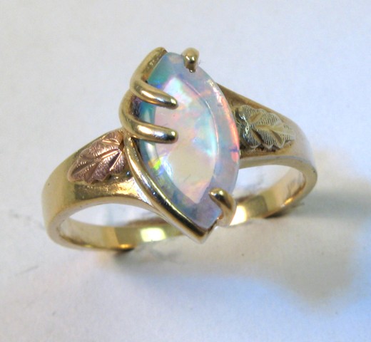 Appraisal: OPAL AND TEN KARAT GOLD RING set with a marquise