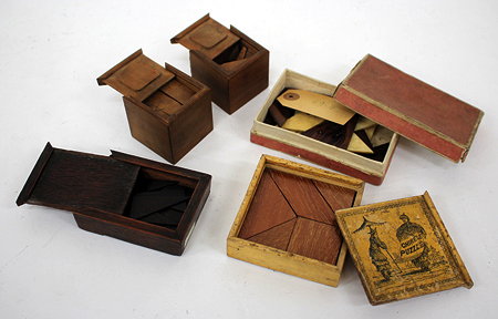 Appraisal: A CHINESE HARDWOOD CUBIC TANGRAM TYPE PUZZLE in a box