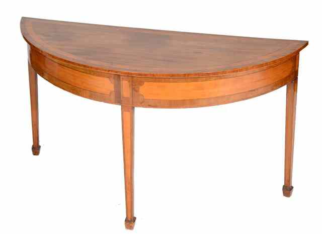 Appraisal: A SHERATON STYLE SATINWOOD HALF ROUND HALL TABLE with cross