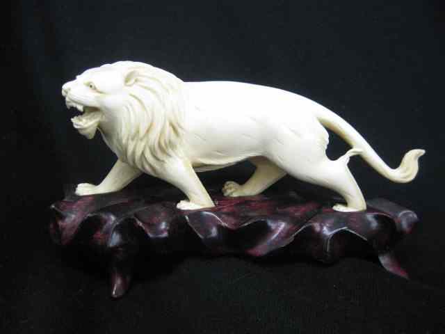 Appraisal: Carved Ivory Figurine of a Lion '' long carved wooden