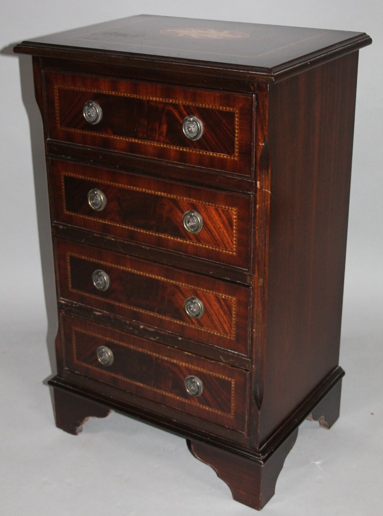 Appraisal: A Sheraton style mahogany finish narrow chest the moulded overhanging