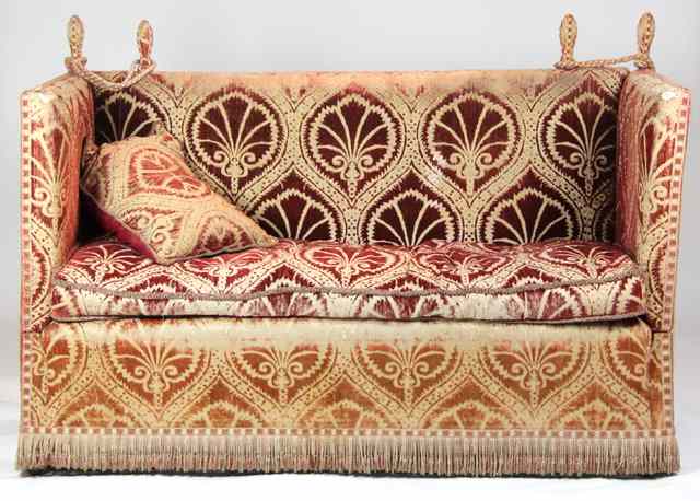 Appraisal: An Edwardian Knole sofa upholstered in red cut velvet with