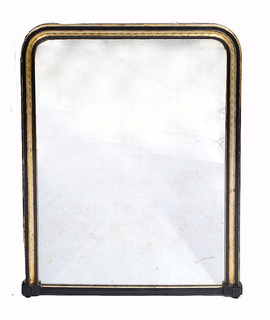 Appraisal: A VICTORIAN EBONISED AND GILDED OVERMANTEL MIRROR with arched top