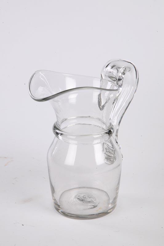 Appraisal: BLOWN GLASS PITCHER Pittsburgh-type th century Clear glass pitcher with