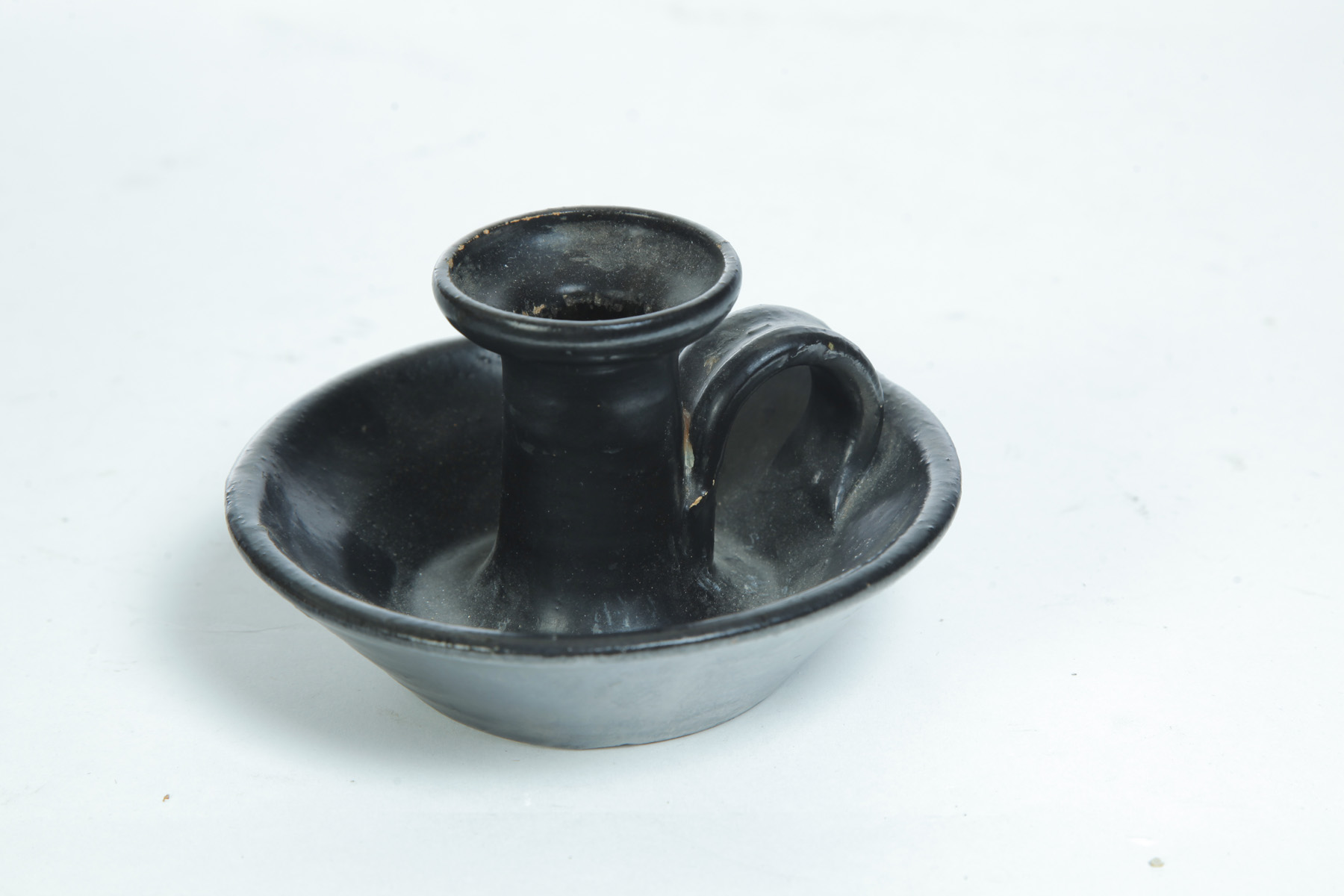 Appraisal: REDWARE CHAMBERSTICK ATTRIBUTED TO SAMUEL ROUTSON Doylestown Ohio nd quarter-