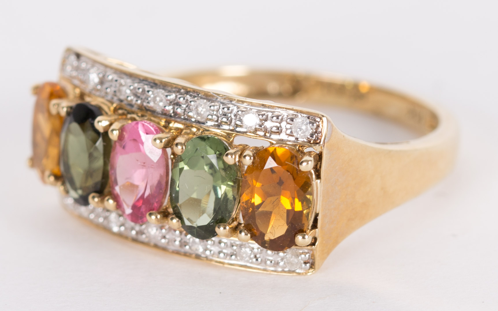 Appraisal: A Multicolor Tourmaline Ring K ring with oval orange stones