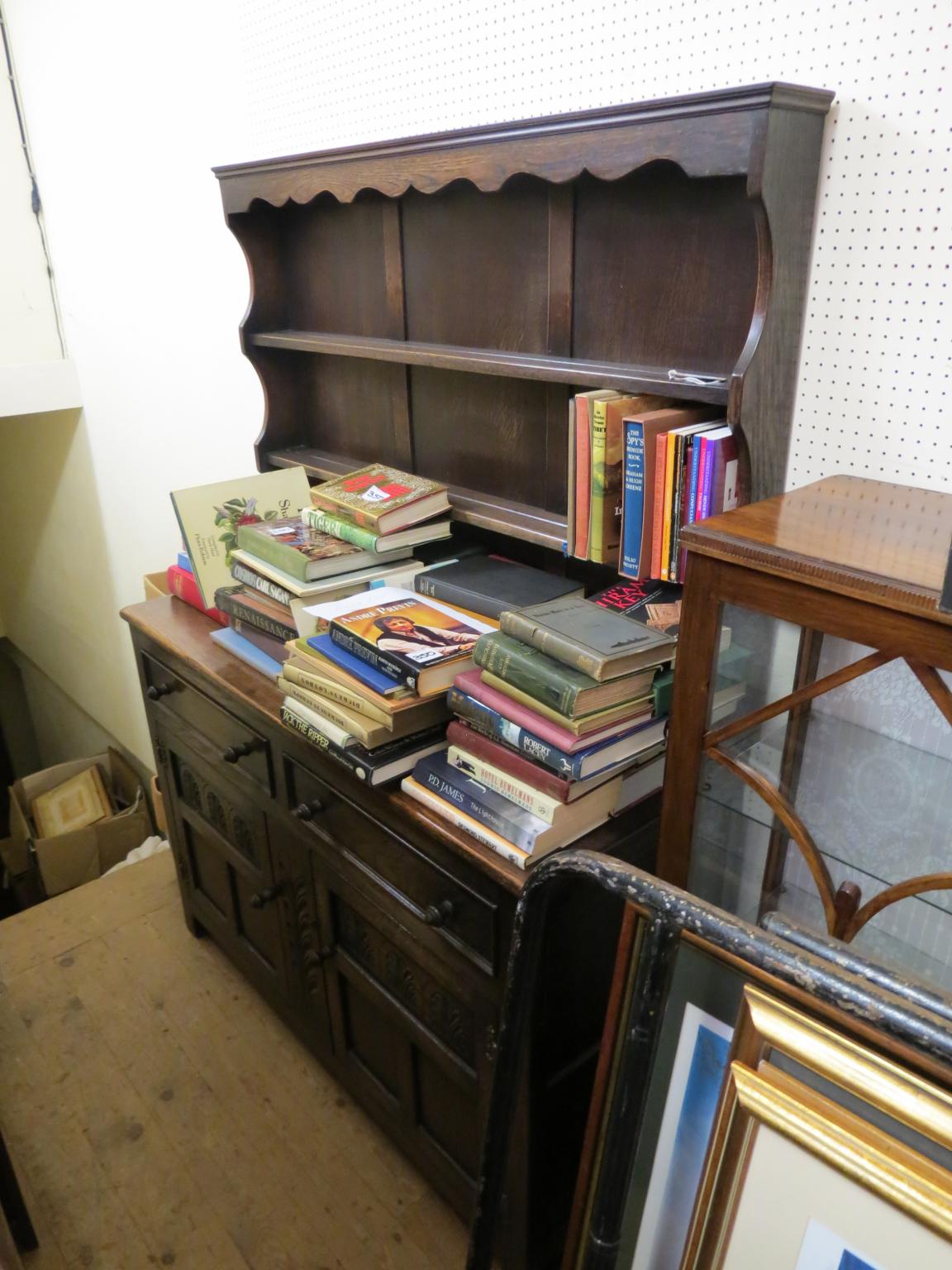 Appraisal: A solid dark oak Welsh dresser twin-shelf plate rack above