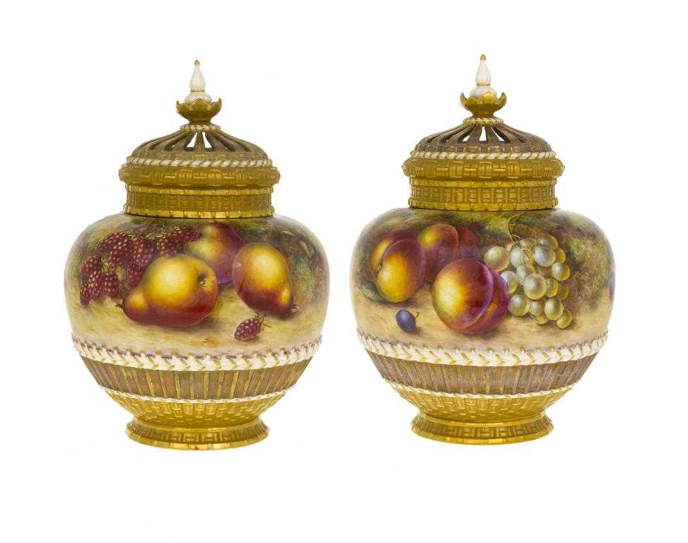 Appraisal: A PAIR OF ROYAL WORCESTER ROSE JARS AND COVERS the