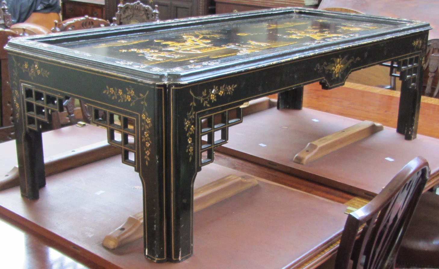 Appraisal: A th century Chinese black lacquer rectangular coffee table decorated