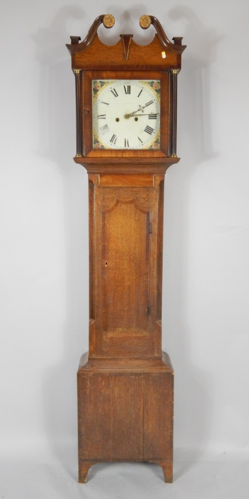 Appraisal: A George III oak and mahogany cross banded longcase clock