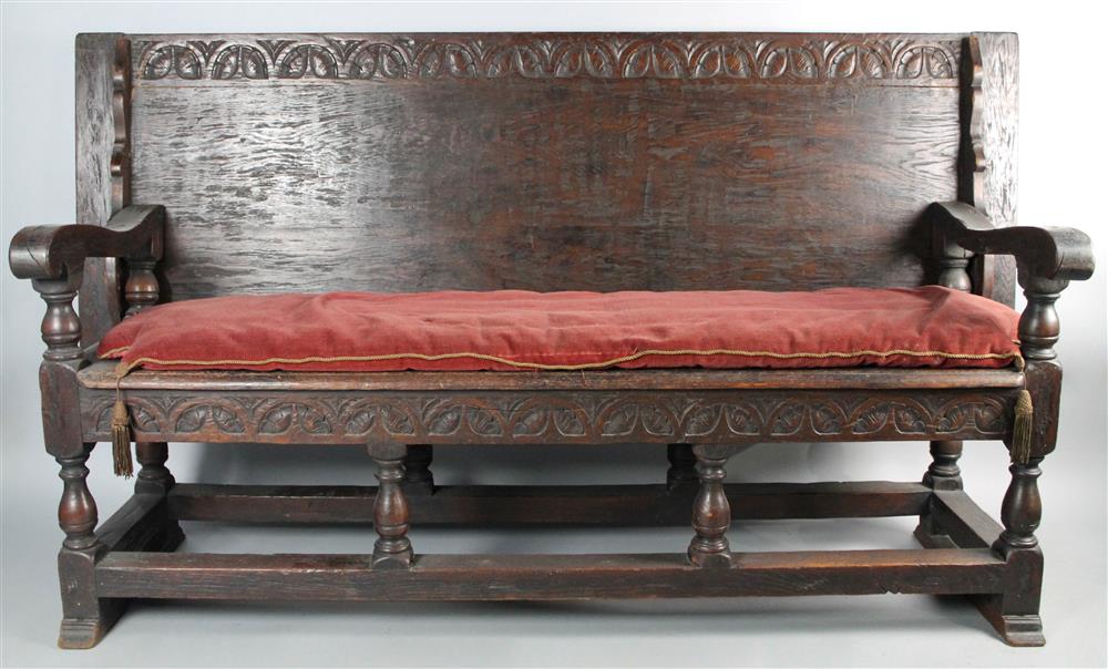 Appraisal: JACOBEAN STYLE OAK TABLE AND SETTEE carved top flips to