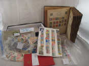 Appraisal: A stamp album filled with about postage stamps mainly pre