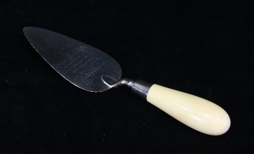 Appraisal: A Victorian silver trowel with ivory handle London inscribed 'This