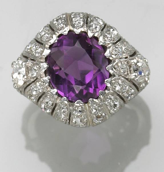 Appraisal: An amethyst diamond and platinum ring Cellini signed Cellini estimated