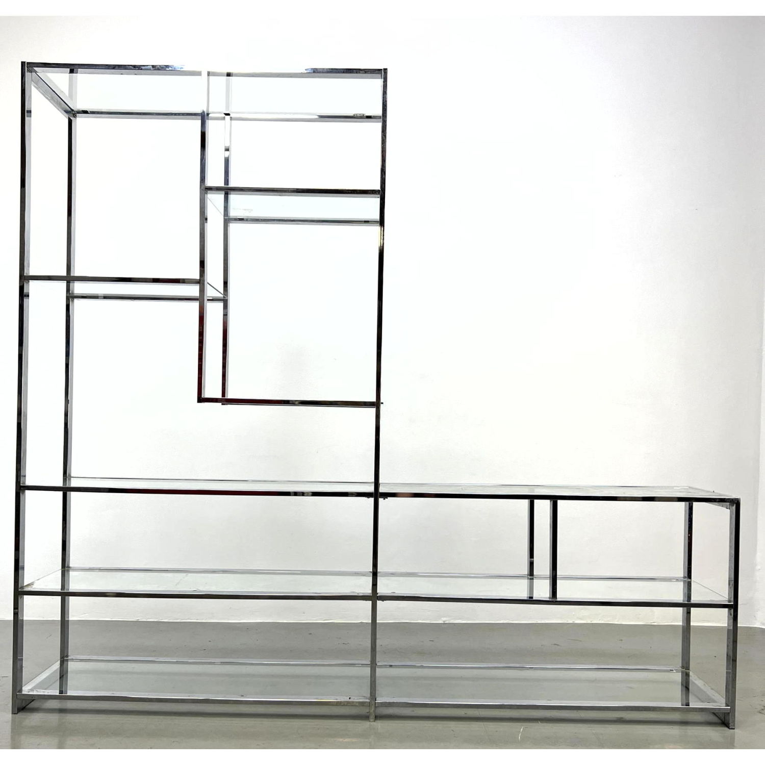 Appraisal: Milo Baughman style chrome and glass etagere shelf Possibly DESIGN