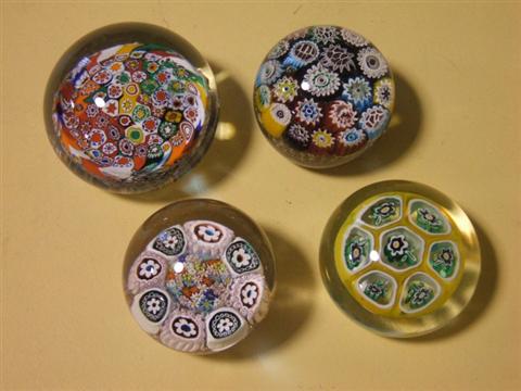 Appraisal: FOUR VARIOUS MILLEFIORI PAPERWEIGHTS Including two concentric millefiori with 'aventurine'