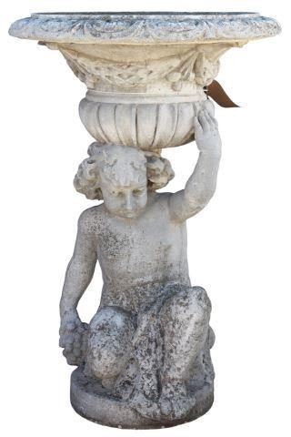 Appraisal: Cast stone putto planter th c campana form urn with