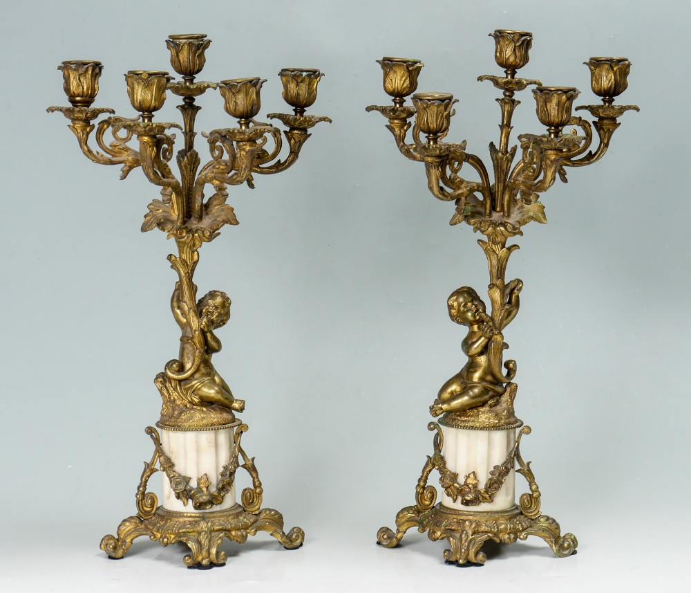 Appraisal: PAIR GILT BRONZE FIGURAL PUTTI CANDELABRA Most likely a clock