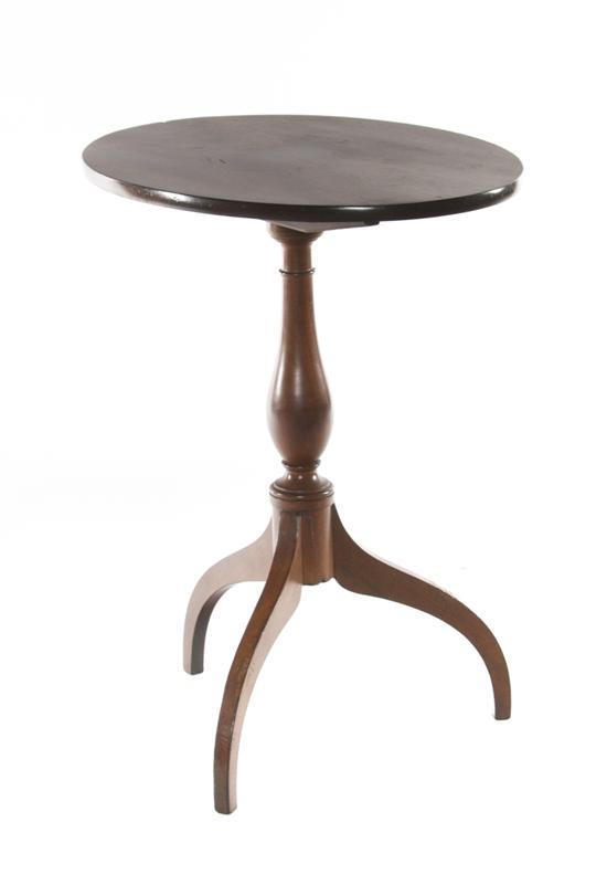 Appraisal: An American Mahogany Tilt-Top Table the oval top raised on