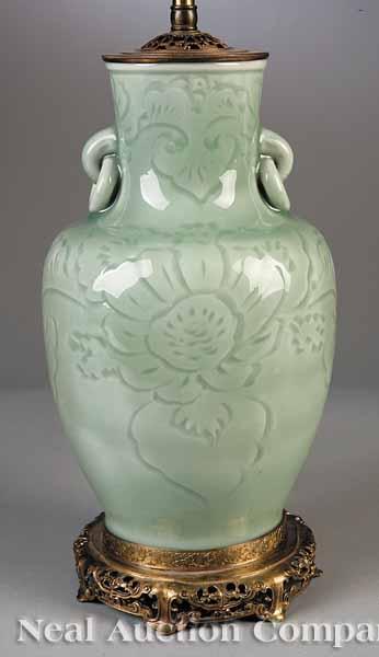 Appraisal: A Chinese Celadon Baluster-Form Vase the body with gently incised