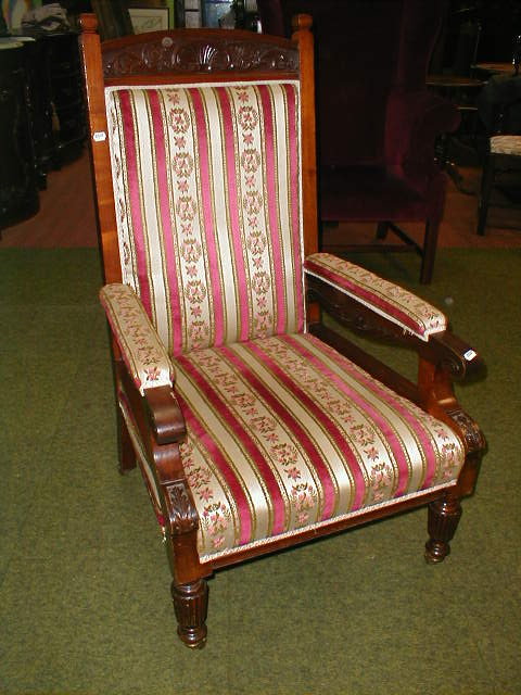 Appraisal: A late Victorian walnut open armchair with striped upholstery