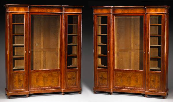 Appraisal: A pair of Napoleon III style inlaid walnut biblioth ques