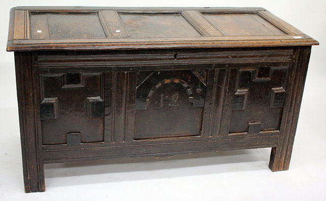 Appraisal: AN ANTIQUE OAK COFFER with triple panelled lid and mitred