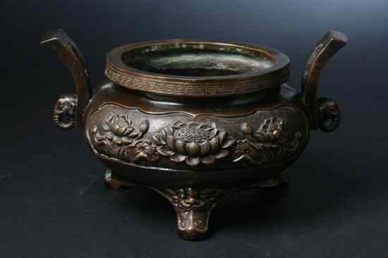 Appraisal: CHINESE BRONZE CENSER Cast with shaped reserves enclosing lotus blossoms