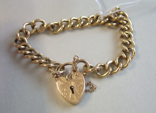 Appraisal: A ct gold curb link bracelet on a ct gold