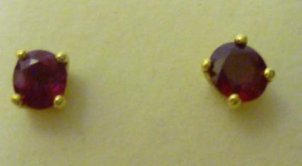 Appraisal: A PAIR OF BURMESE RUBY STUD EARRINGS the oval faceted