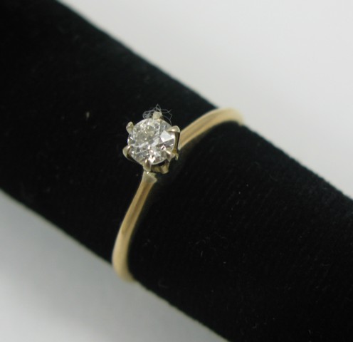 Appraisal: DIAMOND AND FOURTEEN KARAT GOLD RING with appraisal The solitaire