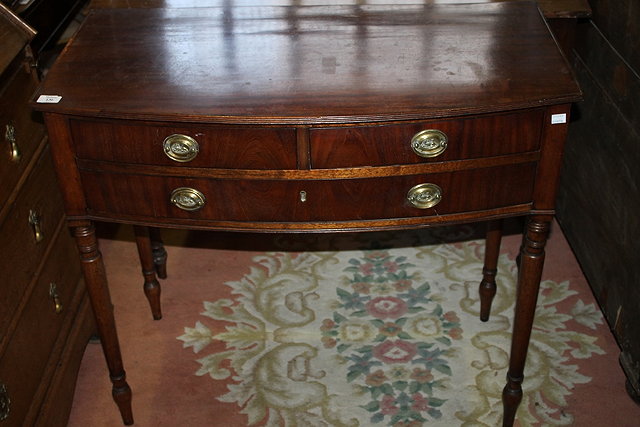 Appraisal: A TH CENTURY MAHOGANY BOW FRONT DRESSING TABLE fitted two