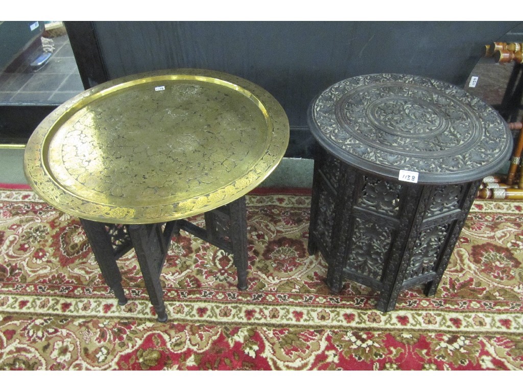 Appraisal: Burmese carved circular table on a folding stand and a