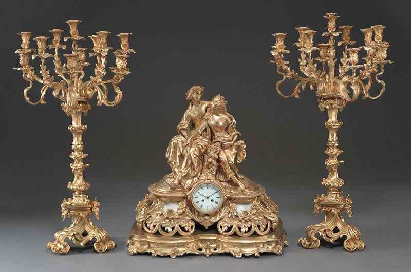 Appraisal: Louis XV style gilt bronze clock garniture set the pair