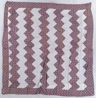 Appraisal: ANTIQUE QUILT TOP AND BLANKET Zig-zag white and brown printed