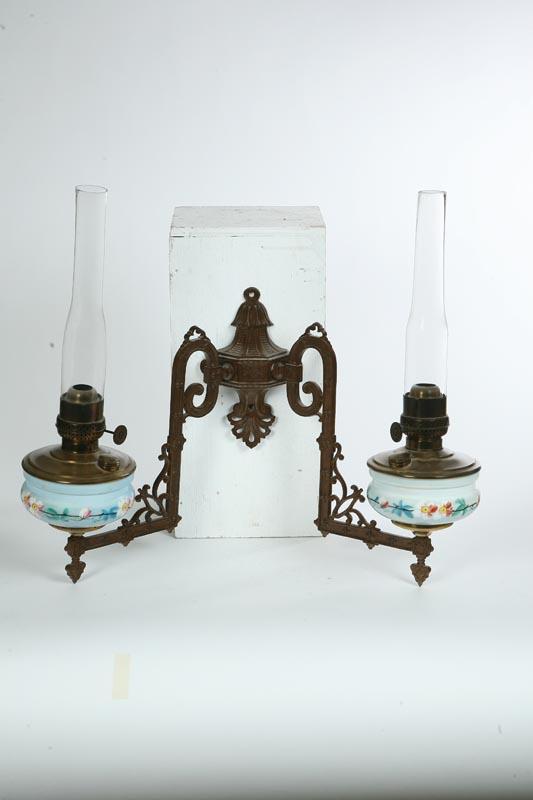 Appraisal: DOUBLE BRACKET LAMP Iron with L shaped arms milk glass