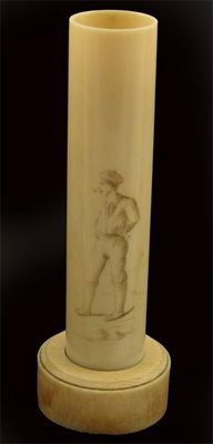 Appraisal: A turned Dieppe ivory spill holder engraved a man with