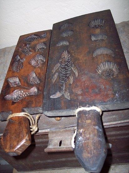 Appraisal: Two treen biscuit moulds each carved with various shapes