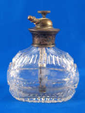 Appraisal: An oval silver mounted cut glass perfume atomiser marked sterling