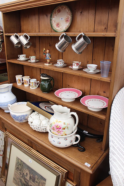 Appraisal: A WAXED PINE COTTAGE DRESSER with boarded three shelf plate