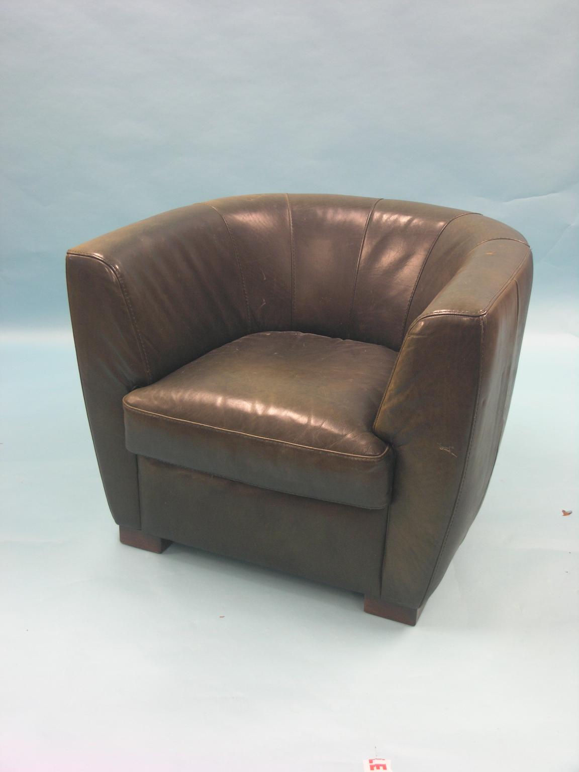 Appraisal: A green leather club chair tub-shape