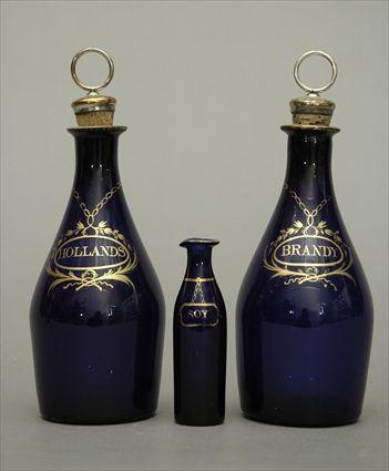 Appraisal: Two George III Bristol Gilt-Decorated Blue Glass Decanters Together with